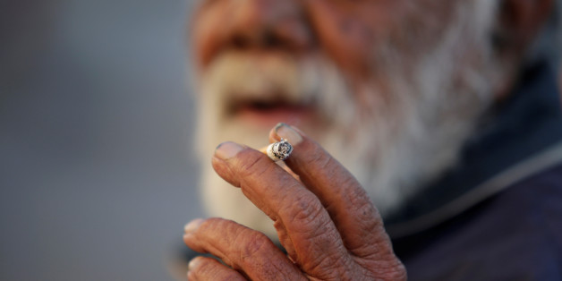 A man smokes a cigarette in Ciudad Juarez, Mexico May 11, 2017. Picture taken May 11, 2017. REUTERS/Jose Luis Gonzalez