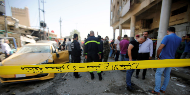 Police tape cordon is seen at the site of a car bomb attack near a government office in Karkh district in Baghdad, Iraq May 30, 2017. REUTERS/Khalid al-Mousily THIS PICTURE WAS PROCESSED BY REUTERS TO ENHANCE QUALITY. AN UNPROCESSED VERSION WILL BE PROVIDED SEPARATELY.