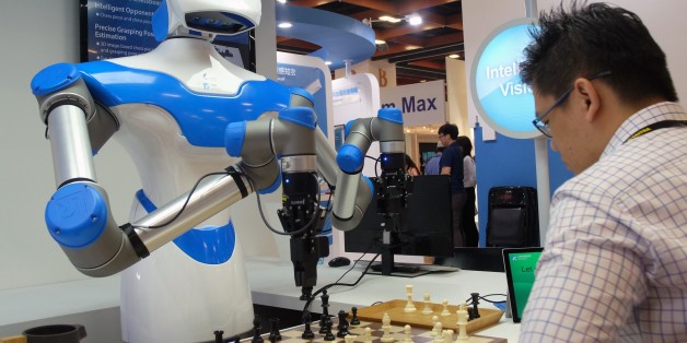 A visitor plays chess with a robot designed by Taiwan's Industrial Technology Research Institute (ITRI) during the Computex Show in Taipei on May 30, 2017.More then 5,000 booths from sixteen thousand companies take part in the annual computer and technology exhibition in Taipei between May 30 to June 3. / AFP PHOTO / SAM YEH (Photo credit should read SAM YEH/AFP/Getty Images)
