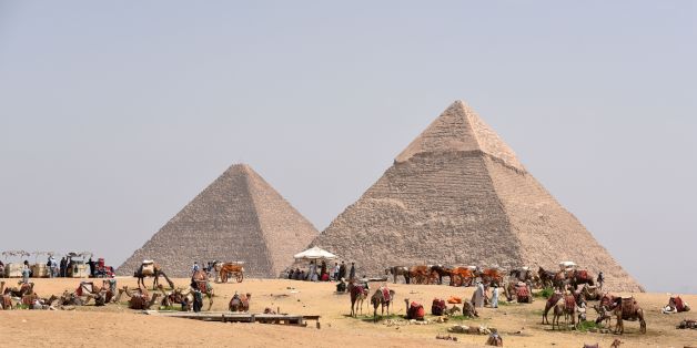 Egyptian camel owners wait for tourists outside the pyramids, on the Giza Plateau, on the southern outskirts of the capital Cairo on March 29, 2017. / AFP PHOTO / MOHAMED EL-SHAHED (Photo credit should read MOHAMED EL-SHAHED/AFP/Getty Images)