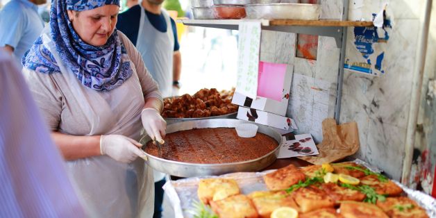 A woman prepares food for Ramadan on May 27, 2017 at a market, in the Barbes area of northern Paris.
The world's nearly 1.5 billion Muslims on May 27 began Ramadan, the holy month of dawn-to-dusk fasting and prayers. / AFP PHOTO / BENJAMIN CREMEL (Photo credit should read BENJAMIN CREMEL/AFP/Getty Images)