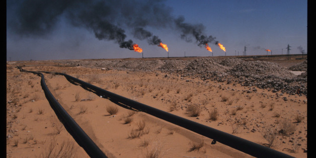 306260 02: Flames indicate gas burn off as pipelines carry oil June 15, 1997 in Hassi Messaoud, Algeria. The recent completion of a multi-billion dollar oil refinery by the Japan Gas Corporation is part of a new effort by Algeria to open up its oil reserves to outside investors. (Photo by Scott Peterson/Liaison)