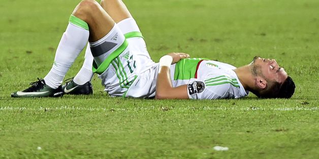 Algeria's defender Rami Bensebaini reacts at the end of the 2017 Africa Cup of Nations group B football match between Algeria and Tunisia in Franceville on January 19, 2017. / AFP / KHALED DESOUKI (Photo credit should read KHALED DESOUKI/AFP/Getty Images)