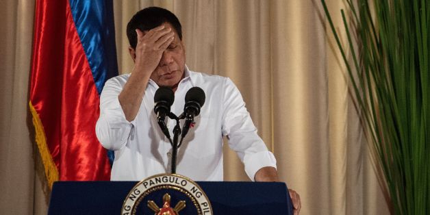 Philippine President Rodrigo Duterte gestures as he gives a speech during the mass oath taking of officials of various national leagues at the Malacanang Palace in Manila on June 1, 2017.
Philippine airstrikes aimed at Islamist militants who are holding hostages as human shields in a southern city killed 11 soldiers, authorities said on June 1, as they conceded hundreds of gunmen may have escaped a blockade. / AFP PHOTO / NOEL CELIS (Photo credit should read NOEL CELIS/AFP/Getty Images)