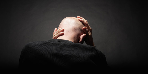 man's head on black background