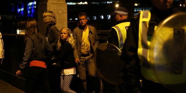 People flee as police attend to an incident near London Bridge in London, Britain, June 4, 2017. REUTERS/Neil Hall