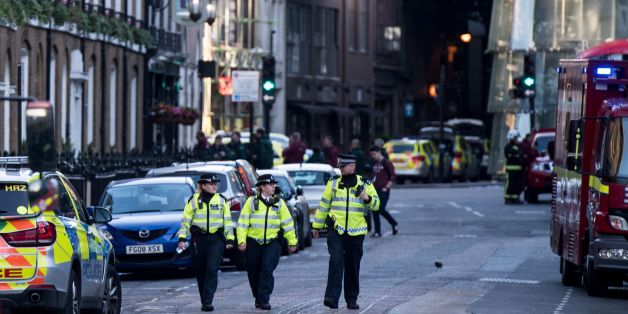 Police officers and emergency response vehicles are seen on the street outside Borough Market on June 04, 2017 the morning after a terror attack on London Bridge and the Borough area in London. Six people have been reportedly killed and three terror suspects shot dead by police following the attack on the evening on June 03, 2017. / AFP PHOTO / CHRIS J RATCLIFFE (Photo credit should read CHRIS J RATCLIFFE/AFP/Getty Images)
