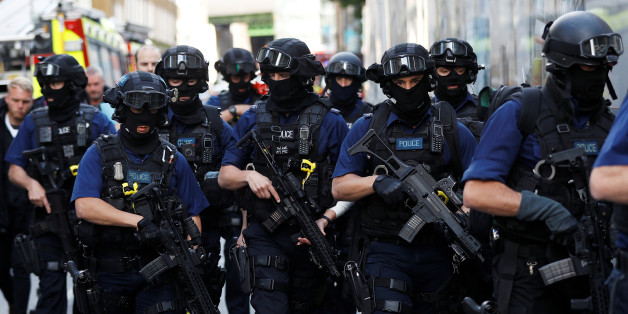 Armed police officers walk near Borough Market after an attack left 7 people dead and dozens injured in London, Britain, June 4, 2017. REUTERS/Peter Nicholls