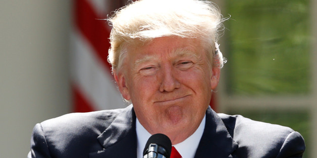 U.S. President Donald Trump pauses as he announces his decision that the United States will withdraw from the landmark Paris Climate Agreement, in the Rose Garden of the White House in Washington, U.S., June 1, 2017. REUTERS/Kevin Lamarque TPX IMAGES OF THE DAY