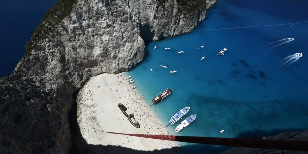 TO GO WITH AFP STORY BY FRANCOISE CHAPTAL
Ropes are attached to jumpers' platform atop the rugged rocks overlooking the azure waters of Navagio beach, one of the Greece's most renowned leisure spots on the popular tourist island of Zakynthos on June 23, 2014. This is rope jumping -- part diving, part rock climbing, with a touch of engineering. The aim of the project is to dream jump in 80 places with most ravishing nature and architecture all over the world .They plan to stage their next leaps at a cave complex in Croatia, a French viaduct, skyscrapers in Las Vegas and Johannesburg, and the Grand Canyon. AFP PHOTO / LOUISA GOULIAMAKI (Photo credit should read LOUISA GOULIAMAKI/AFP/Getty Images)