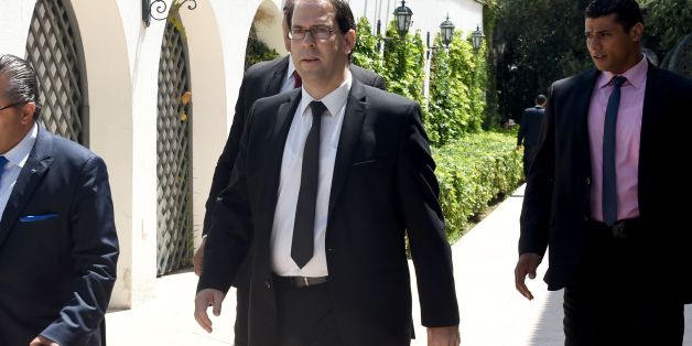 Tunisia's premier-designate Youssef Chahed (C) arrives to give a press conference to present his proposed new unity government list after he submitted it to the president on August 20, 2016 in Carthage, near the capital Tunis.
Chahed, a 40-year-old former local affairs minister and member of the Nidaa Tounes party, had been given 30 days to form a cabinet. If his cabinet wins the backing of parliament, Chahed will become the North African country's youngest premier since independence from France in 1956.
/ AFP / FETHI BELAID (Photo credit should read FETHI BELAID/AFP/Getty Images)