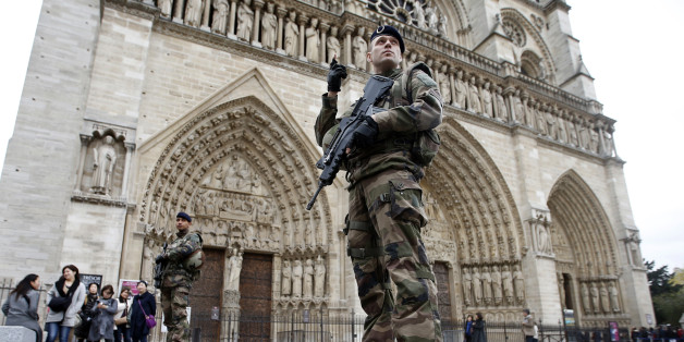 French police stand at the scene of a shooting incident near the Notre Dame Cathedral in Paris, France, June 6, 2017. REUTERS/Philippe Wojazer