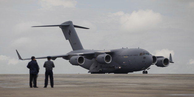 A Royal Australian Air Force (RAAF) C-17 Globemaster III transport plane carrying donated aid for Myanmar's flood victims lands at Yangon international airport in Yangon August 10, 2015. REUTERS/Soe Zeya Tun