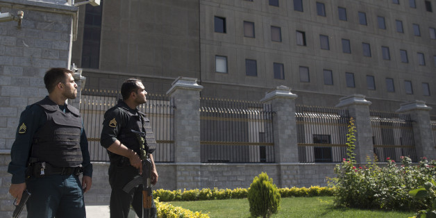 TEHRAN, IRAN - JUNE 7: Police officers stand outside Iran's parliament building following an attack by several gunmen on June 7, 2017 in Tehran, Iran. At least 12 people were killed and dozens more wounded during simultaneous gun and suicide bomb attacks in Iran's capital. A suicide bomber targeted the shrine of Ayatollah Ruhollah Khomeini while several gunmen launched an attack on the parliament building, which is now reportedly over following hours of audible gun-fire. (Photo by Majid Saeedi/