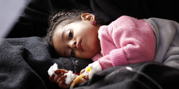 A Yemeni child, suspected of being infected with cholera, receives treatment at a hospital in Sanaa on May 15, 2017. / AFP PHOTO (Photo credit should read /AFP/Getty Images)