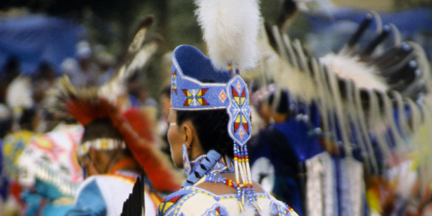 Ladies traditional Pow Wow dancer dressed in white brain tanned leather regalia with beautiful beaded strips and headdress crown at the Chippewa-Cree pow wow on the Rocky Boy Indian Reservation, Montana