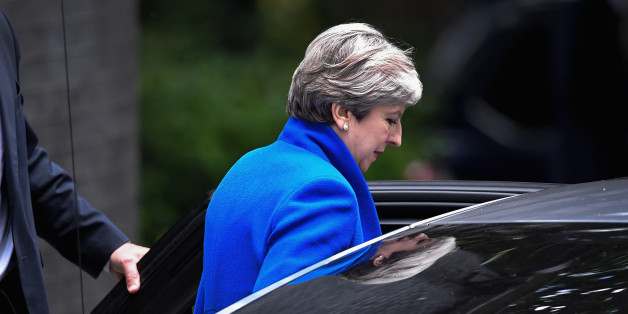 LONDON, ENGLAND - JUNE 09: Britain's Prime Minister and leader of the Conservative Party Theresa May leaves 10 Downing Street en route to Buckingham Palace to meet Queen Elizabeth II, the day after a general election on June 9, 2017 in London, England. After a snap election was called by Prime Minister Theresa May the United Kingdom went to the polls yesterday. The closely fought election has failed to return a clear overall majority winner and a hung parliament has been declared. (Photo by Jeff J Mitchell/Getty Images)