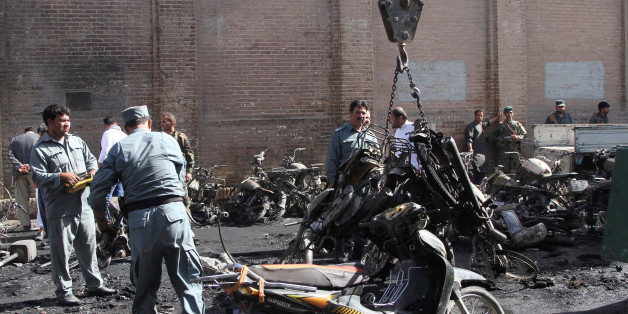 Afghan policemen inspects at the site of a blast in Afghanistan June 6, 2017. REUTERS/Mohammad Shoib
