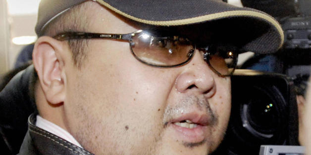 Beijing, CHINA: A man believed to be North Korean leader Kim Jong-Il's eldest son, Kim Jong-Nam, is surrounded by journalists upon his arrival at Beijing's capital airport, 11 February 2007. Wearing a cap, sunglasses and jeans, the man who Japanese television crew described as Kim Jong-Nam arrived at Beijing's airport from Macau in the afternoon, as six-nation talks on ending North Korea's nuclear weapons programme were underway in the Chinese capital. Kim Jong-Nam, 35, was recently reported to