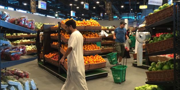 Customers are seen shopping at the al-Meera market in the Qatari capital Doha, on June 10, 2017. Saudi Arabia, Egypt, the UAE and Bahrain announced on June 5 they were cutting diplomatic ties and closing air, sea and land links with Qatar, giving Qataris within their borders two weeks to leave. / AFP PHOTO / STRINGER (Photo credit should read STRINGER/AFP/Getty Images)