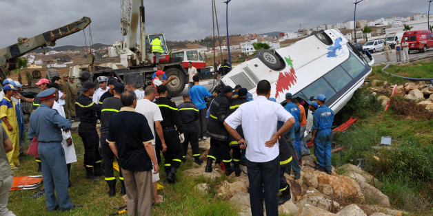 Rescue workers check the debris of an overturned tourist bus in northern Morocco September 8, 2010. Eight Portuguese tourists were killed and 13 wounded on Wednesday when their bus overturned in northern Morocco, local government officials said. The bus was travelling from the Spanish enclave of Ceuta towards the Moroccan city of Tetouan when the accident occurred near the Errifiyyines area, the officials told Reuters. REUTERS/Stringer (PORTUGAL - Tags: DISASTER) THIS IMAGE HAS BEEN SUPPLIED BY