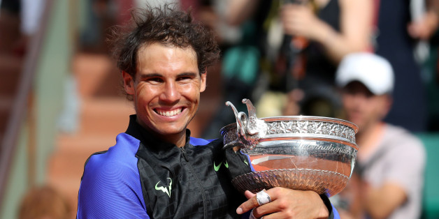 Tennis - French Open - Roland Garros, Paris, France - June 11, 2017 Spain's Rafael Nadal celebrates with the trophy after winning the final against Switzerland's Stan Wawrinka Reuters / Pascal Rossignol