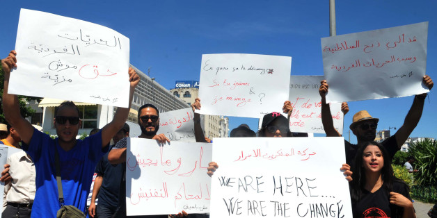 Tunisian protesters hold placards during a demonstration for the right to eat and smoke in public during the Muslim dawn-to-dusk fasting month of Ramadan, on June 11, 2017, in Tunis.
A court in northern Tunisia handed one-month jail terms in the beginning of June to four men for eating in public during the Ramadan fast. / AFP PHOTO / Sofienne HAMDAOUI (Photo credit should read SOFIENNE HAMDAOUI/AFP/Getty Images)