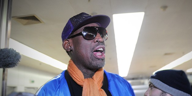Former US basketball player Dennis Rodman talks to the media upon arriving at Beijing International Airport from North Korea on January 13, 2014. Rodman returned to China from Pyongyang after a seven-day trip where he sang 'Happy birthday to you!' to North Korean leader Kim Jong-Un on January 8. AFP PHOTO / WANG ZHAO (Photo credit should read WANG ZHAO/AFP/Getty Images)