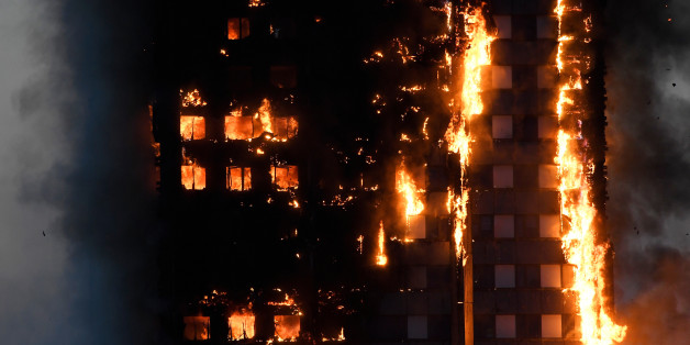 Flames and smoke billow as firefighters deal with a serious fire in a tower block at Latimer Road in West London, Britain June 14, 2017. REUTERS/Toby Melville