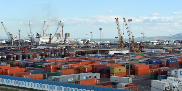 Cranes and containers are pictured on November 12, 2014, in the Tunisian port city of Rades. The World Bank said in a report published last September that Tunisia's economic model of manufacturing for exports and protecting the domestic market was valid in the 1970s but since then had hindered progress. AFP PHOTO / FETHI BELAID (Photo credit should read FETHI BELAID/AFP/Getty Images)