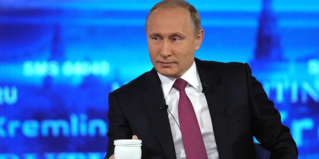 Russian President Vladimir Putin answers questions at the Gostiny Dvor studio during the annual 'Direct Line with Vladimir Putin broadcast live' by Russian TV channels and radio stations in Moscow on June 15, 2017. / AFP PHOTO / SPUTNIK / Mikhail KLIMENTYEV (Photo credit should read MIKHAIL KLIMENTYEV/AFP/Getty Images)