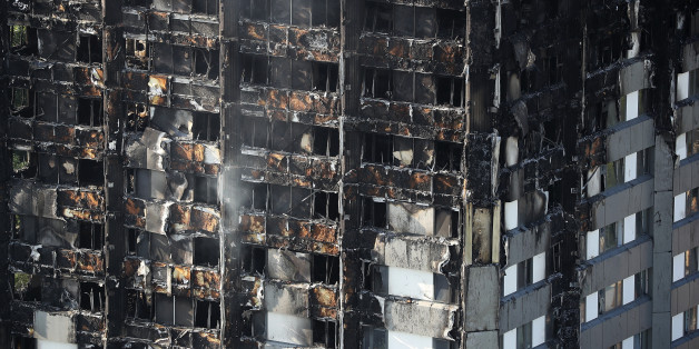LONDON, ENGLAND - JUNE 15: Grenfall tower continues to smoulder on June 15, 2017 in London, England. At least twelve people have been confirmed dead and dozens missing, after the 24 storey residential Grenfell Tower block in Latimer Road was engulfed in flames in the early hours of June 14. The number of fatalities are expected to rise. (Photo by Dan Kitwood/Getty Images)