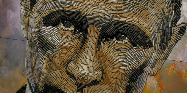 THIS IMAGE IS BINNED
A portrait of Russian President Vladimir Putin, made out of 5,000 cartridges brought from the frontline in eastern Ukraine, named "The Face of War" is seen in the studio of Ukrainian artist Dariya Marchenko, in Kiev, July 23, 2015. Portrait will be presented along with a novel which will tell personal stories of six people involved in this project including Daria's own story and stories of people who helped her to collect shells from the frontline. Daria Marchenko calls her art approach philosophic symbolism where every element has its hidden meaning. In her works cartridges mean human's life that was brutally ended. Picture taken July 23, 2015. REUTERS/Gleb Garanich TPX IMAGES OF THE DAY