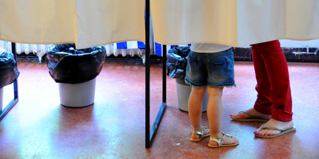 French people cast their vote during the second round of the French presidential election, on May 7, 2017 in La Marsa near Tunis, Tunisia. (Photo by Riadh Dridi/NurPhoto via Getty Images)