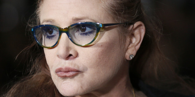 Actress Carrie Fisher poses at the world premiere of the film "Dumb and Dumber To" in Los Angeles, November 3, 2014. REUTERS/Danny Moloshok (UNITED STATES - Tags: ENTERTAINMENT)