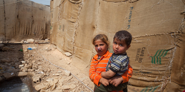 Beqaa, Lebanon - May 03, 2013: Syrian Refugee children in one of the tented camps in Beqaa Lebanon. One of the children showing signs of Leishmania.