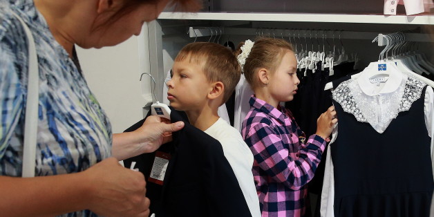 MOSCOW, RUSSIA - AUGUST 13, 2016: Customers in the school uniform section of a Smena store. Smena Holding produces school uniforms and children's clothes. Sergei Fadeichev/TASS (Photo by Sergei Fadeichev\TASS via Getty Images)