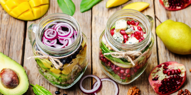 homemade healthy salads with vegetables, fruits, beans and quinoa in jar. toning. selective Focus