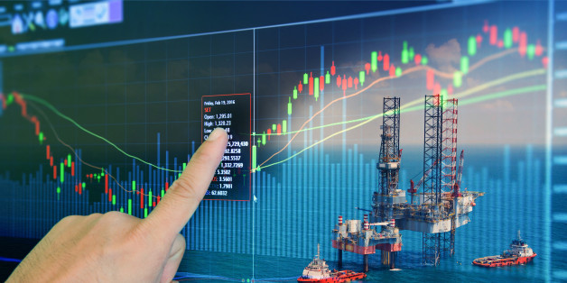 Stock market concept with oil rig in the gulf and oil refinery industry background,Double exposure