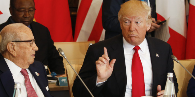 U.S. President Donald Trump talks to German Chancellor Angela Merkel (L) and Tunisia's President Beji Caid Essebsi (2-L) at the G7 Summit expanded session, on May 27, 2017 in Taormina, Sicily. / AFP PHOTO / POOL / JONATHAN ERNST (Photo credit should read JONATHAN ERNST/AFP/Getty Images)