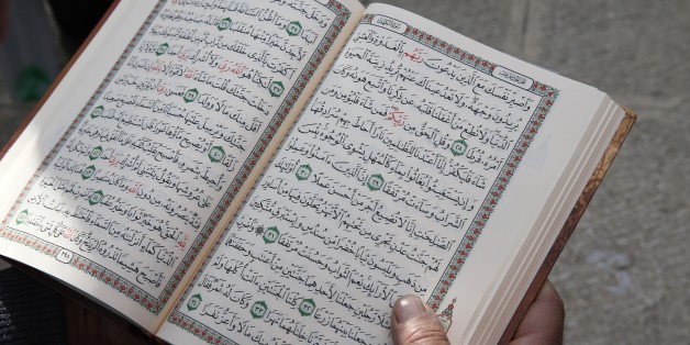 Palestinian reading the Coran outside Al-Aqsa mosque, Jerusalem (Photo by: Godong/UIG via Getty Images)