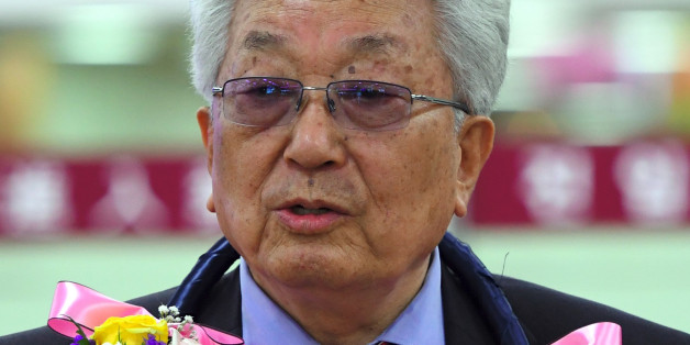 Jang Woong, North Korea's delegate to the International Olympic Committee (IOC), speaks to the media upon his arrival at Gimpo airport in Seoul on June 23, 2017, as he arrives for a taekwondo conference.A North Korean official on June 23 said he will discuss the idea of co-hosting South Korea's 2018 Winter Games with Olympic chief Thomas Bach. Jang Woong, the North's delegate to the International Olympic Committee, will meet IOC president Bach in South Korea next week. / AFP PHOTO / JUNG Yeon-Je