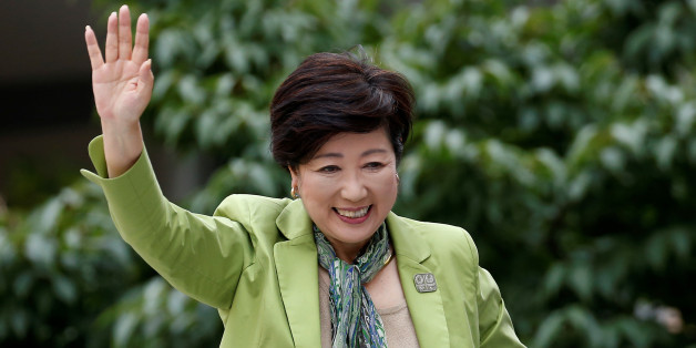 Tokyo Governor and head of Tokyo Citizens First party Yuriko Koike waves to voters atop of a campaign van as election campaign officially kicks off for Tokyo Metropolitan Assembly election, on the street in Tokyo June 23, 2017. REUTERS/Issei Kato