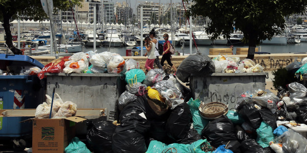 ATHENS, GREECE - JUNE 27: Mounds of rubbish fester in soaring temperatures because of municipal workers' strike on June 27, 2017 in Athens, Greece. With rubbish piling up in parts of the city, Athens municipality urged residents not to take out their waste as temperatures topped 36 Celsius. (Photo by Milos Bicanski/Getty Images)