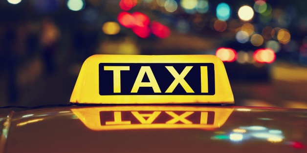 Taxi car on the street at night