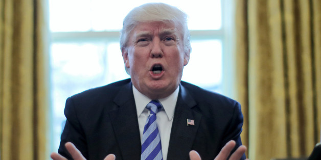 President Trump reacts to the AHCA health care bill being pulled by Congressional Republicans before a vote as he speaks about the bill in the Oval Office of the White House in Washington, U.S., March 24, 2017. REUTERS/Carlos Barria