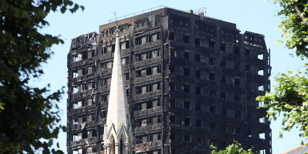 A church spire stands in the foreground of Grenfell Tower in North Kensington, London, Britain, June 19, 2017. REUTERS/Marko Djurica