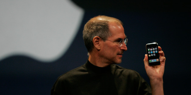 Apple Computer Inc. Chief Executive Officer Steve Jobs holds the new iPhone in San Francisco, California January 9, 2007. Apple unveiled an eagerly-anticipated iPod mobile phone with a touch-screen on Tuesday, priced at $599 for 8 gigabytes of memory, pushing the company's shares up as much as 8.5 percent. Jobs said the iPhone, which also will be available in a 4-gigabyte model for $499, will ship in June in the United States. The phones will be available in Europe in the fourth quarter and in A