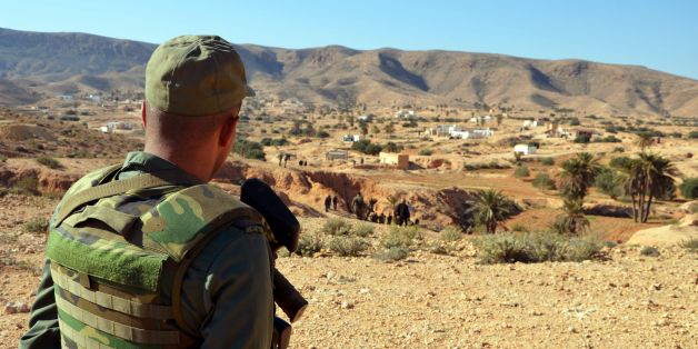 A member of the Tunisian security forces takes part in a security sweep in the mountainous Tounine area, some 30 kilometres (20 miles) south of the coastal town of Gabes, on February 2, 2016.
Tunisian forces have killed three suspected jihadists during an ongoing operation in the Gabes region in which one of their men was wounded, the interior ministry said. / AFP / FATHI NASRI (Photo credit should read FATHI NASRI/AFP/Getty Images)