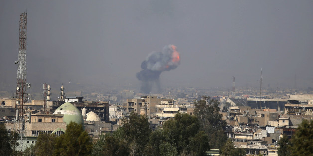 Fire and smoke billow following a reported car bomb explosion as Iraqi forces clash with Islamic State (IS) group fighters in the embattled city of Mosul on April 7, 2017.The operation by Iraqi forces to retake Mosul has become a slow, grinding battle that has taken a heavy toll on civilians and pushed more than 200,000 to flee. / AFP PHOTO / AHMAD GHARABLI (Photo credit should read AHMAD GHARABLI/AFP/Getty Images)